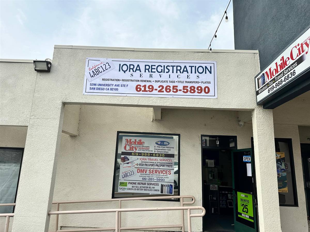 The Mobile City storefront at Unit F with the IQRA Registration Services banner above the door